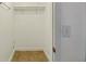 Walk-in closet provides storage solutions with shelving for your wardrobe needs at 1741 Font Ln, Holiday, FL 34691