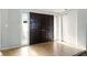 Welcoming foyer entrance with double doors and sidelights and a coat closet at 1741 Font Ln, Holiday, FL 34691