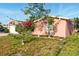 Charming single-Gathering home featuring a lush garden and mature landscaping at 1741 Font Ln, Holiday, FL 34691