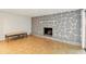 Cozy living area showcases stone fireplace and ample space for comfortable seating at 1741 Font Ln, Holiday, FL 34691