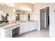 Bright bathroom with double vanity, granite countertops, and ample cabinet storage at 3826 E 155Th E Ave, Parrish, FL 34219