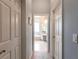 Hallway view leading to the primary bathroom with tub and vanity at 3826 E 155Th E Ave, Parrish, FL 34219