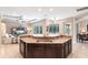 Spacious kitchen with a central island, stainless steel appliances, and an open view of the living area, ideal for entertaining at 3826 E 155Th E Ave, Parrish, FL 34219