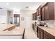 Modern kitchen featuring granite countertops, stainless steel appliances, and ample cabinet space, designed for culinary enthusiasts at 3826 E 155Th E Ave, Parrish, FL 34219