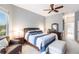 Bright main bedroom features large windows, ceiling fan, neutral decor, and ensuite bathroom at 3826 E 155Th E Ave, Parrish, FL 34219