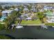 Stunning waterfront home with lush lawn, boat dock, and lift, offering direct access to the bay at 7056 Hawks Harbor Cir, Bradenton, FL 34207