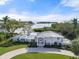 Beautiful waterfront home featuring manicured lawn and stunning bay views at 7056 Hawks Harbor Cir, Bradenton, FL 34207