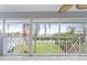 Close-up of the screened lanai overlooking the waterway with decorative railing at 7056 Hawks Harbor Cir, Bradenton, FL 34207