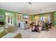 An airy living room features tile floors, neutral furniture, and a fireplace at 7056 Hawks Harbor Cir, Bradenton, FL 34207