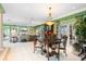 An open-concept living space boasts decorative columns and views of the waterway at 7056 Hawks Harbor Cir, Bradenton, FL 34207