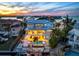 Stunning coastal home with pool, dock, and bay views at sunset at 718 Key Royale Dr, Holmes Beach, FL 34217