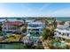 Expansive aerial view of a luxurious waterfront property with a pool, boat dock, and views of the ocean at 718 Key Royale Dr, Holmes Beach, FL 34217