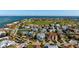 Stunning aerial view of a coastal community with golf course, ocean access, and luxury homes at 718 Key Royale Dr, Holmes Beach, FL 34217