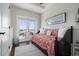 Cozy bedroom with a daybed, French doors to a balcony, and striped rug, perfect for relaxing at 718 Key Royale Dr, Holmes Beach, FL 34217