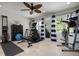 Home gym with workout equipment, neutral flooring, large mirrors and natural light at 718 Key Royale Dr, Holmes Beach, FL 34217