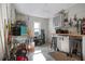 Tidy garage featuring storage cabinets, work bench, tile flooring, mounted storage and tool racks, and a small window at 718 Key Royale Dr, Holmes Beach, FL 34217