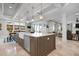 Gourmet kitchen featuring large island, stainless steel appliances, pendant lighting and open-concept design at 718 Key Royale Dr, Holmes Beach, FL 34217