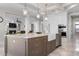 Open-concept kitchen featuring a large island with seating and high-end stainless steel appliances at 718 Key Royale Dr, Holmes Beach, FL 34217