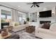 Stylish living room with built-in shelving, fireplace, comfortable seating, and bright natural light at 718 Key Royale Dr, Holmes Beach, FL 34217