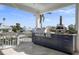 Inviting outdoor kitchen featuring modern grill and pizza oven overlooking the waterfront at 718 Key Royale Dr, Holmes Beach, FL 34217