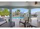Comfortable outdoor lounge area with view of pool and neighborhood at 718 Key Royale Dr, Holmes Beach, FL 34217