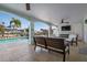 Covered outdoor living space overlooking the pool, perfect for relaxation and entertaining at 718 Key Royale Dr, Holmes Beach, FL 34217