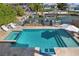 Aerial view of the pool, with the outdoor furniture and mature tropical landscaping at 718 Key Royale Dr, Holmes Beach, FL 34217