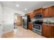 Kitchen featuring stainless steel appliances, ample counter space, and adjacent dining area at 1000 San Lino Cir # 1032, Venice, FL 34292