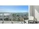A luxury balcony featuring seating and a stunning view of the city skyline and marina at 101 S Gulfstream Ave # 16J, Sarasota, FL 34236