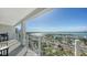 Expansive balcony view overlooking the marina and bay, featuring glass railings and outdoor seating at 101 S Gulfstream Ave # 16J, Sarasota, FL 34236
