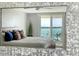 Bedroom with a beautiful waterfront view and plenty of natural light shining through the windows at 101 S Gulfstream Ave # 16J, Sarasota, FL 34236