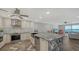 Modern kitchen featuring stainless steel appliances, granite countertops, and an open layout with water views at 101 S Gulfstream Ave # 16J, Sarasota, FL 34236