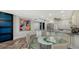 Open concept kitchen featuring modern art, stainless appliances, and bar seating at 101 S Gulfstream Ave # 16J, Sarasota, FL 34236