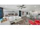 Open living space with herringbone floors, modern decor, and seamless flow into the kitchen and dining area at 101 S Gulfstream Ave # 16J, Sarasota, FL 34236