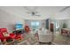 Bright living room with water views, a modern stone accent wall, and herringbone floors at 101 S Gulfstream Ave # 16J, Sarasota, FL 34236