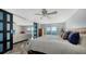 Bright bedroom with waterfront views, a dresser, and direct access to the living space at 101 S Gulfstream Ave # 16J, Sarasota, FL 34236
