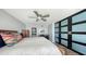 Cozy bedroom with a bathroom, office space, and a hardwood-style floor at 101 S Gulfstream Ave # 16J, Sarasota, FL 34236