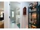 Bright bathroom featuring a glass enclosed shower, neutral tile flooring, and decorative accents at 11728 Meadowgate Pl, Bradenton, FL 34211