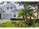 Charming two-story home featuring a lovely garden, well-manicured lawn and a two-car garage at 11728 Meadowgate Pl, Bradenton, FL 34211