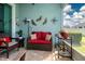 Cozy outdoor lanai with comfortable seating, stylish decor, and serene ambiance at 11728 Meadowgate Pl, Bradenton, FL 34211