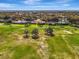 Beautiful aerial view of a home situated on a lush golf course with mature trees and manicured lawns at 124 Ventana Way, Venice, FL 34292