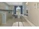 Light and airy bathroom featuring double vanity, soaking tub, and glass enclosed shower at 124 Ventana Way, Venice, FL 34292