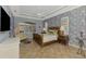 Spacious bedroom features beautiful wallpaper, tile floors, and a tray ceiling with a ceiling fan at 124 Ventana Way, Venice, FL 34292