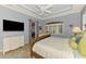 Bright bedroom with plantation shutters, neutral walls and tile flooring at 124 Ventana Way, Venice, FL 34292