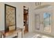 Entry foyer featuring transom windows, tile floor and a glimpse of a study and formal living space at 124 Ventana Way, Venice, FL 34292