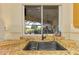Kitchen sink overlooks lanai and golf course through a bright, sunlit window at 124 Ventana Way, Venice, FL 34292