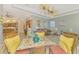 Open living room with a view of the kitchen and breakfast nook at 124 Ventana Way, Venice, FL 34292
