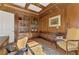 Beautiful office space featuring custom wood paneling and built in bookshelves at 124 Ventana Way, Venice, FL 34292
