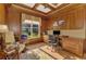 Elegant office featuring custom wood paneling, coffered ceilings, and large window with natural light at 124 Ventana Way, Venice, FL 34292