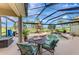 Relaxing pool area with an outdoor table and chairs, surrounded by lush landscaping and a golf course at 124 Ventana Way, Venice, FL 34292